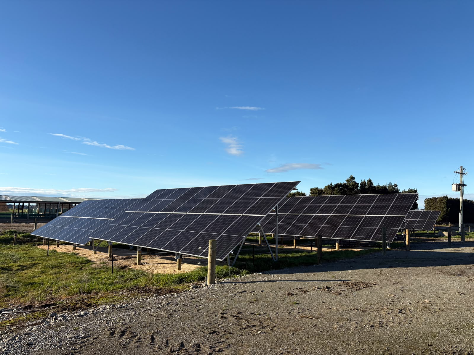 Solar panels installed by a dairy farm shed in Waitaki Valley